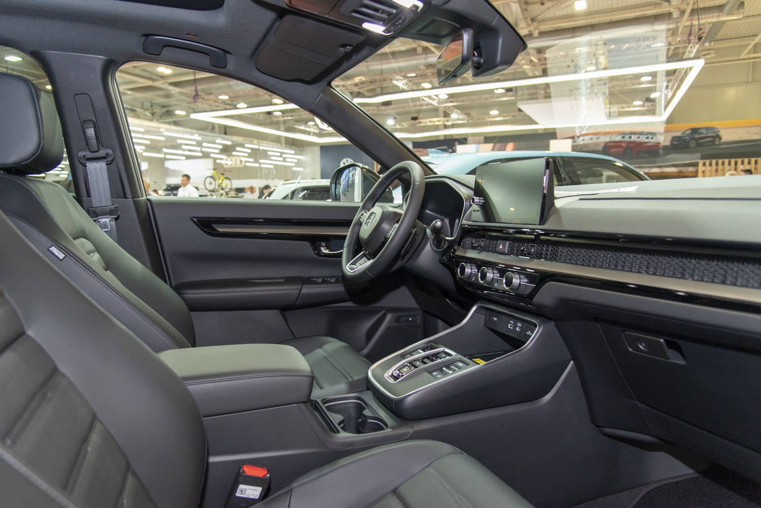 Modern SUV interior with digital dashboard and push-button gear selector
