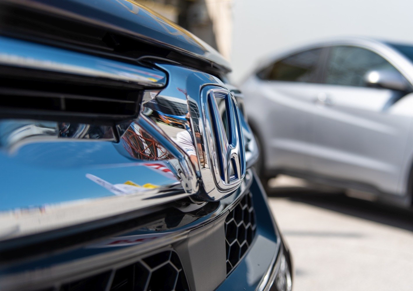 Close-up of chrome front grille and emblem on SUV