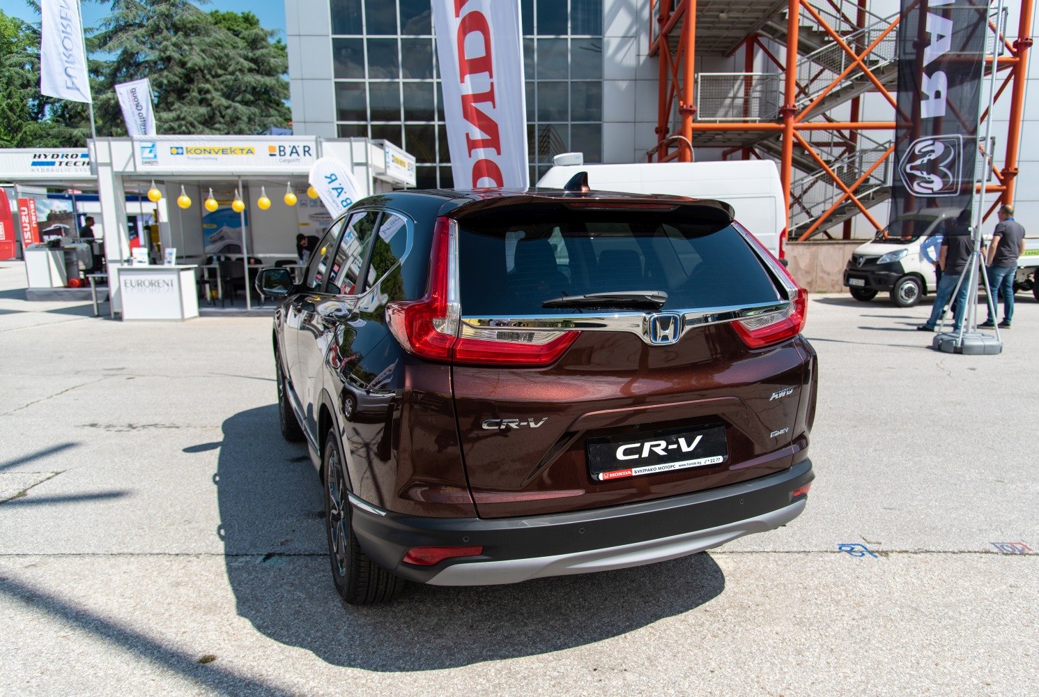 Rear view with prominent tail lights and rear hatch of SUV