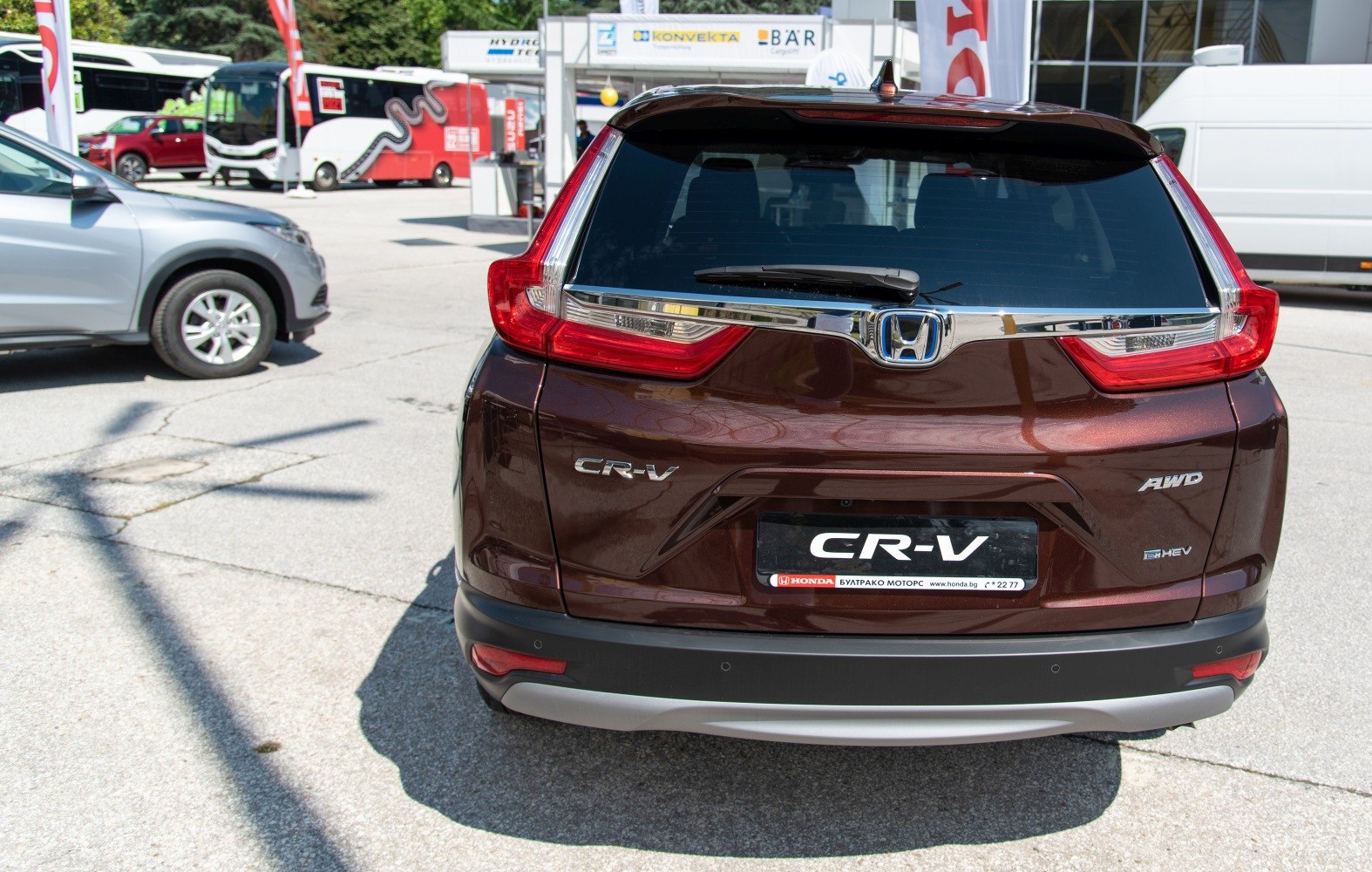 Rear view of SUV with AWD and hybrid badges