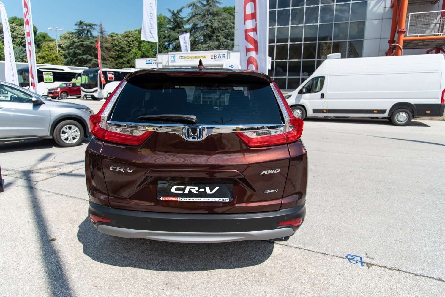 Rear view of SUV with AWD and hybrid badges