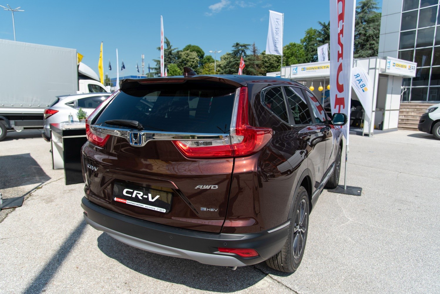 Rear view of SUV with rear lights, AWD and hybrid badges