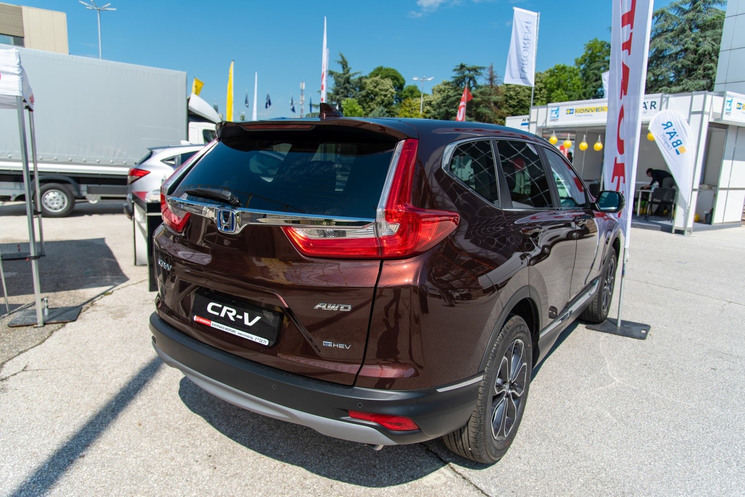 Rear view of SUV with distinct taillights, AWD, and hybrid badges