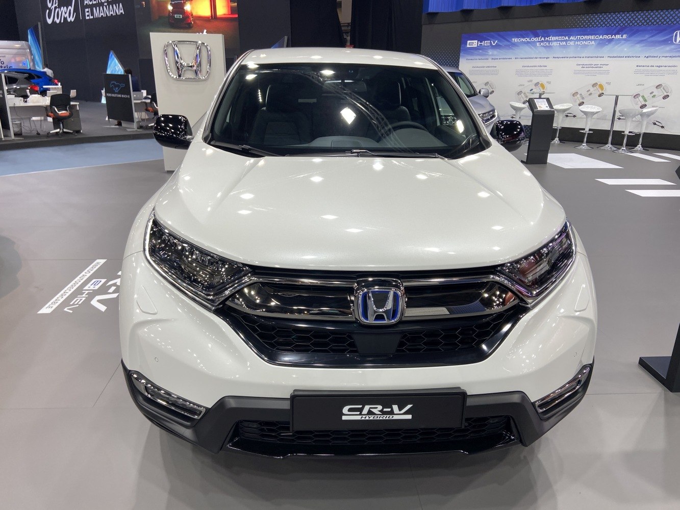 Front view with grille and headlights of a white SUV