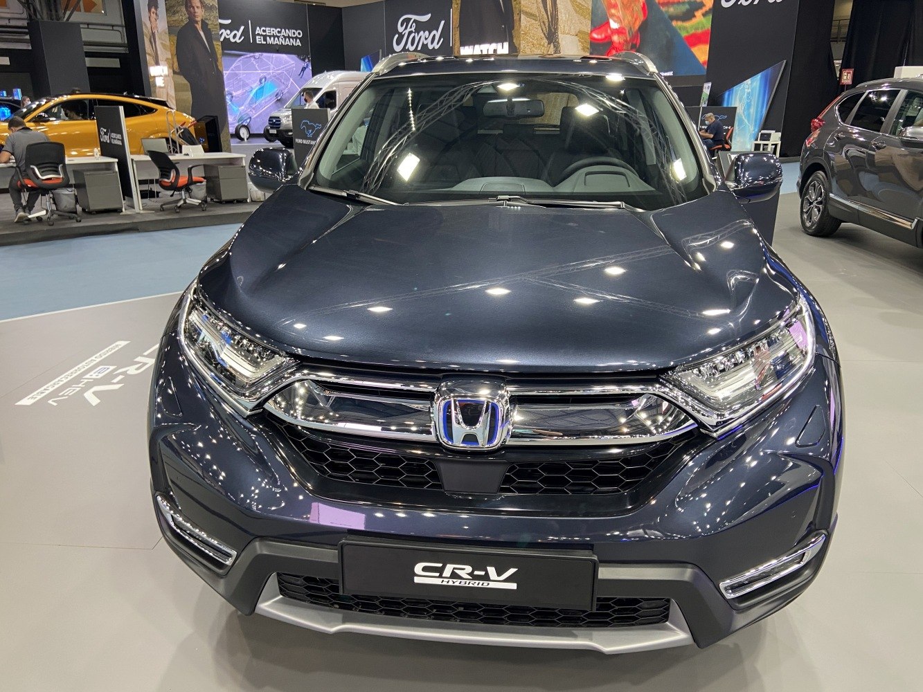 Front view with grille, LED headlights, and bumper of hybrid SUV