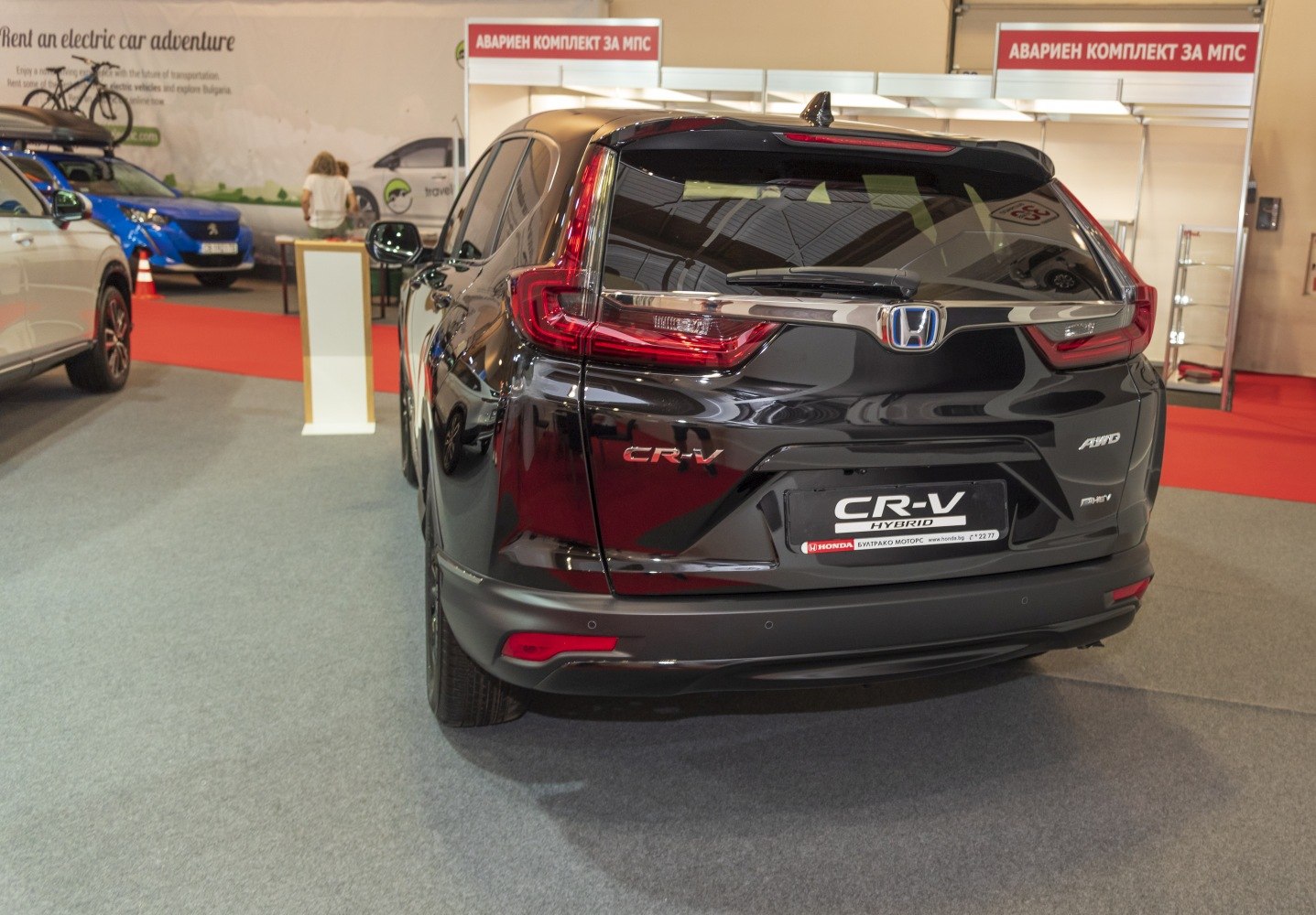 Rear view of a hybrid SUV with distinctive taillights and AWD badge