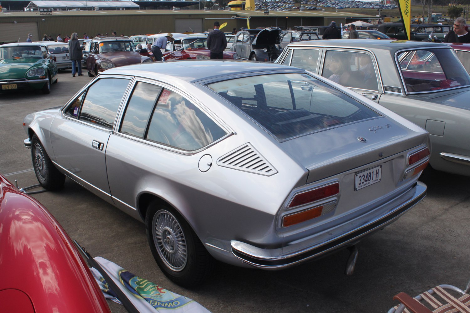 Silver fastback coupe with rear window louvers and alloy wheels