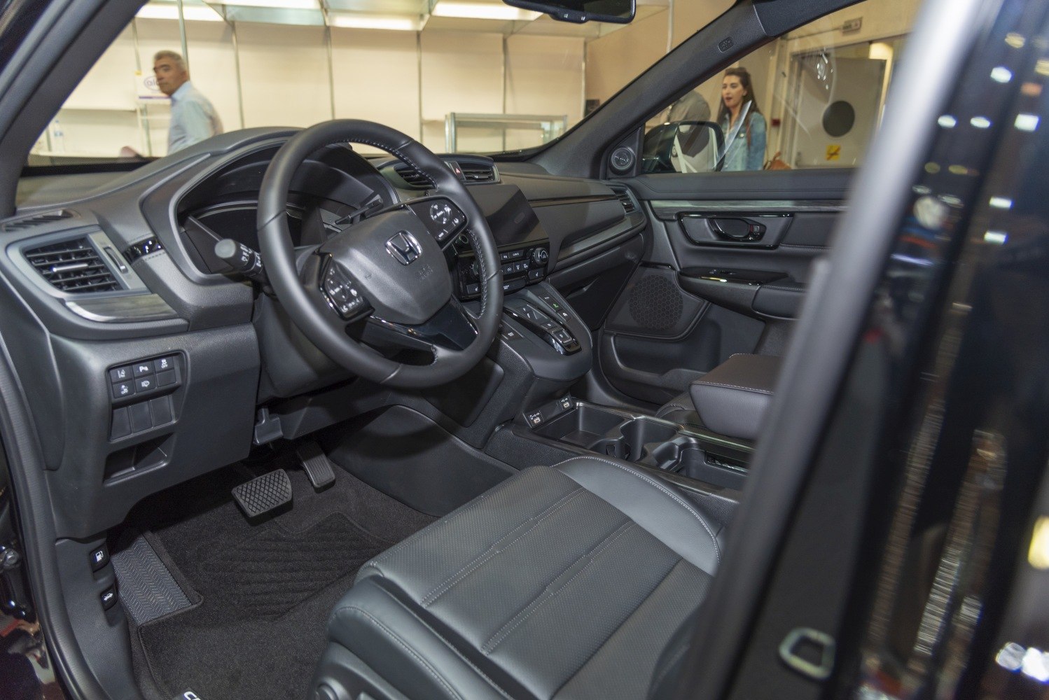 Modern car interior with steering wheel and dashboard controls