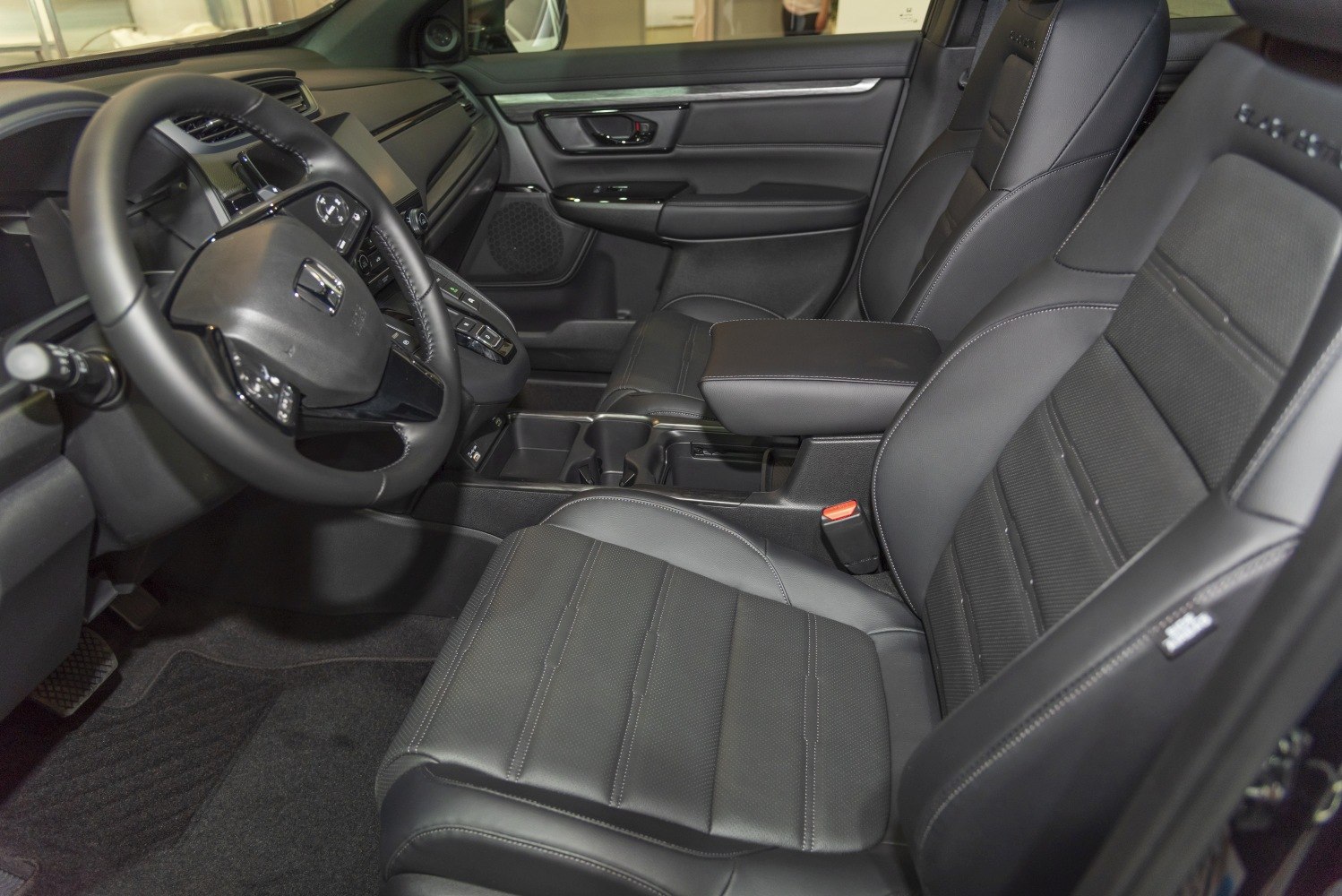 Leather seats and modern dashboard with steering wheel controls