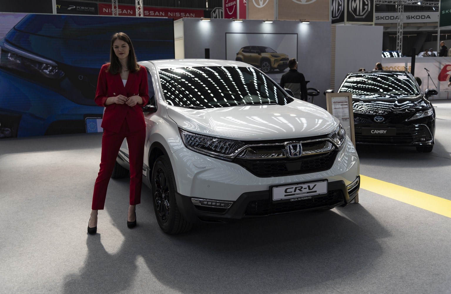 Front view of white SUV with modern headlights and grille