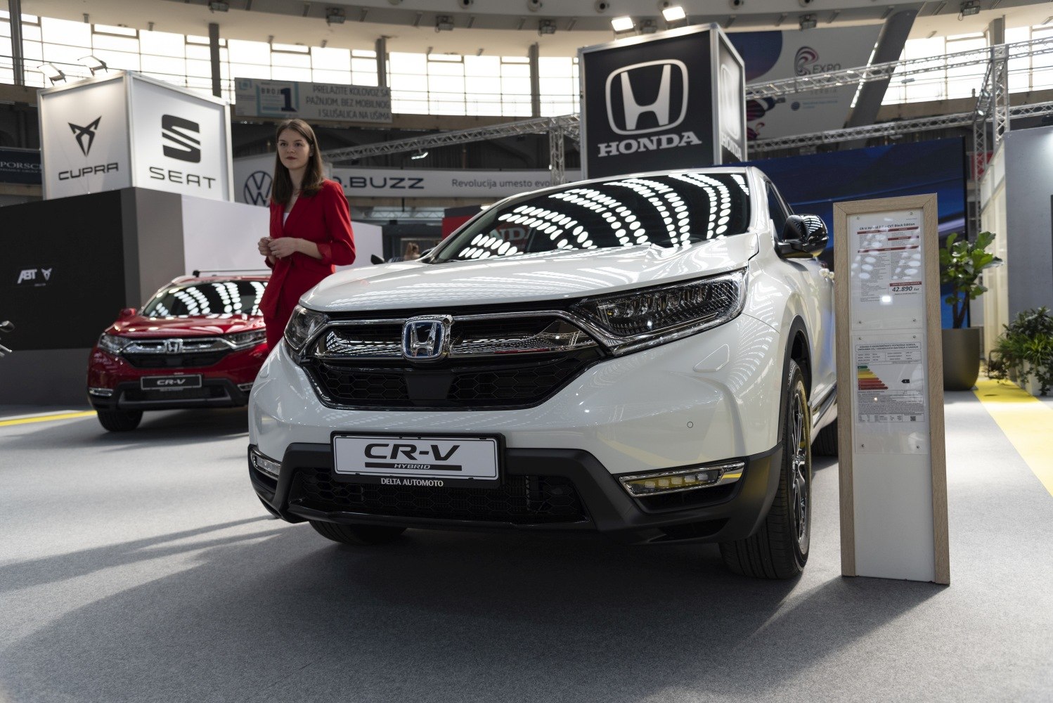 Front view of SUV with hybrid badge and modern headlights