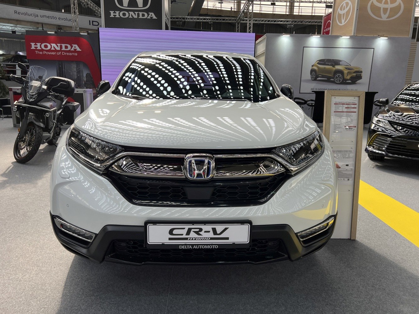 Front view of a hybrid SUV with distinctive grille and headlight design.