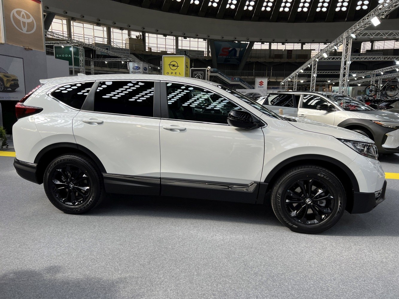 Side view of an SUV with black alloy wheels and tinted windows