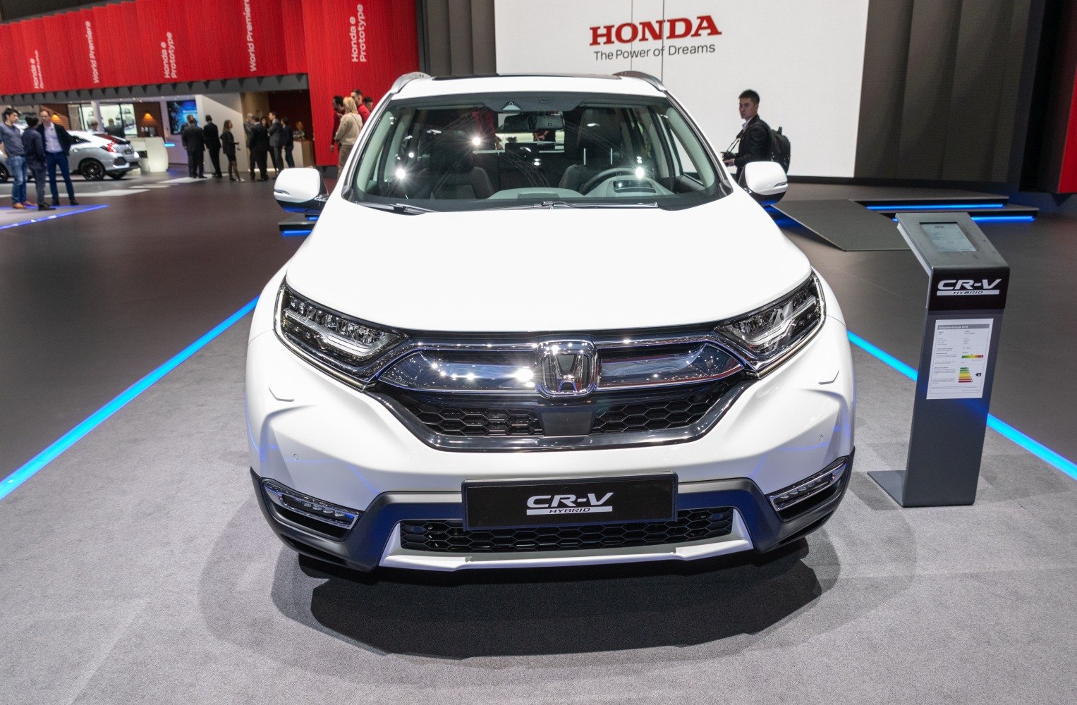 Front grille and LED headlights of a white SUV