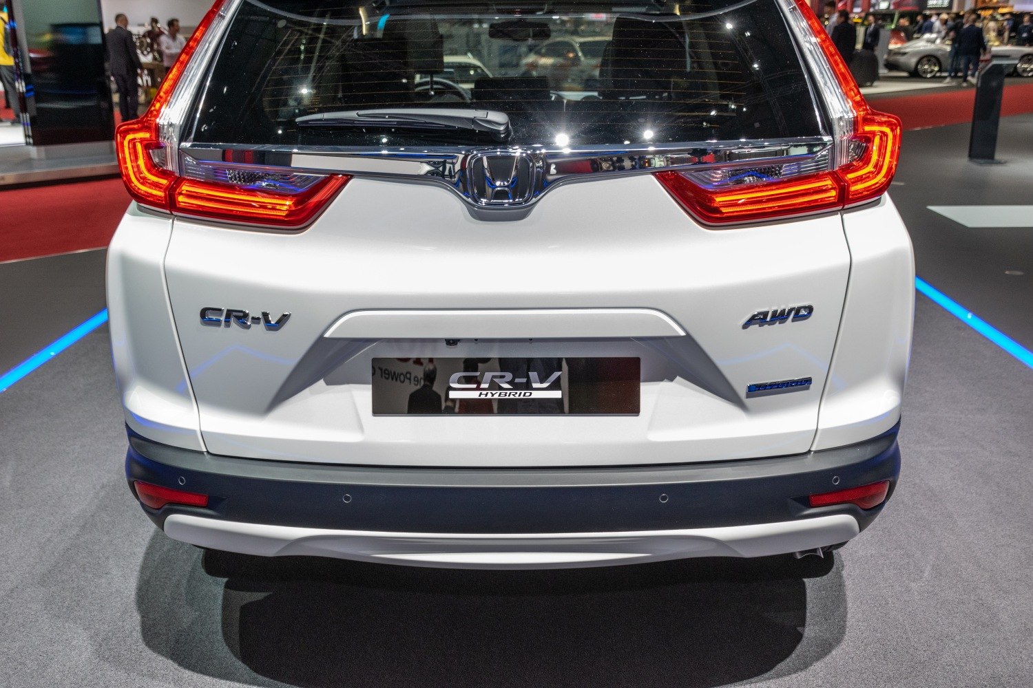 Rear view with hybrid and AWD badges and distinctive taillights
