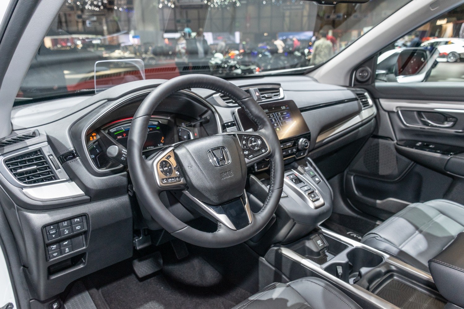Multifunction steering wheel and digital dashboard display in a modern SUV interior