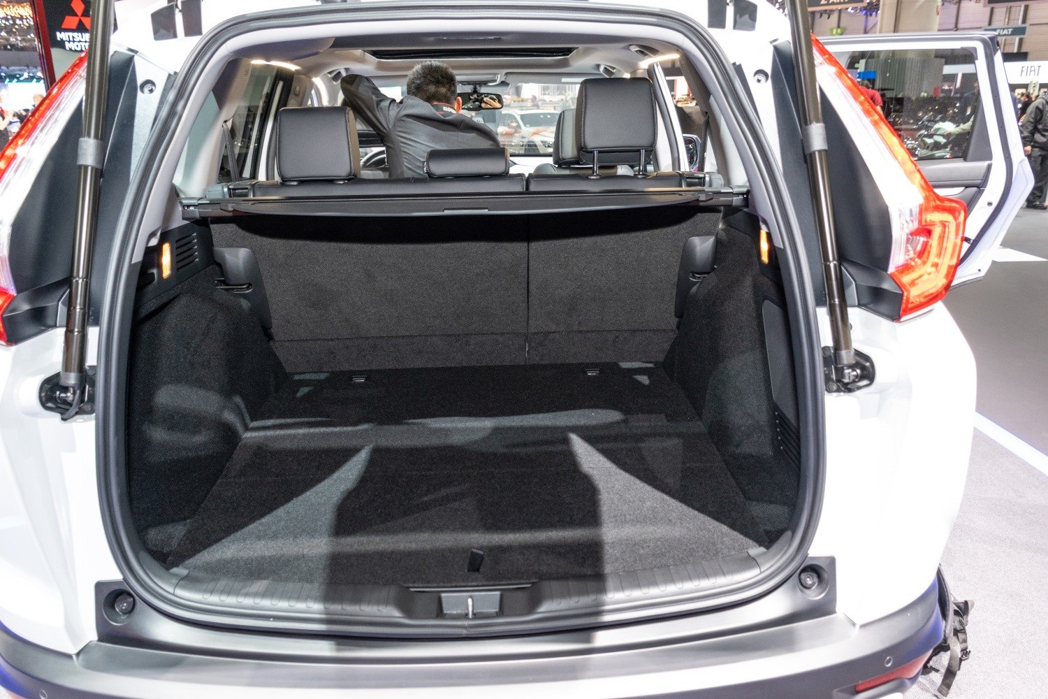 Spacious rear cargo area with retractable cover and visible rear seats