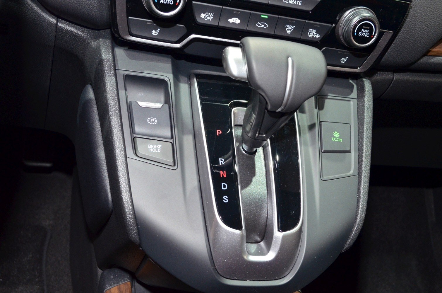 Automatic gear shift lever and control panel with electronic parking brake and climate control buttons