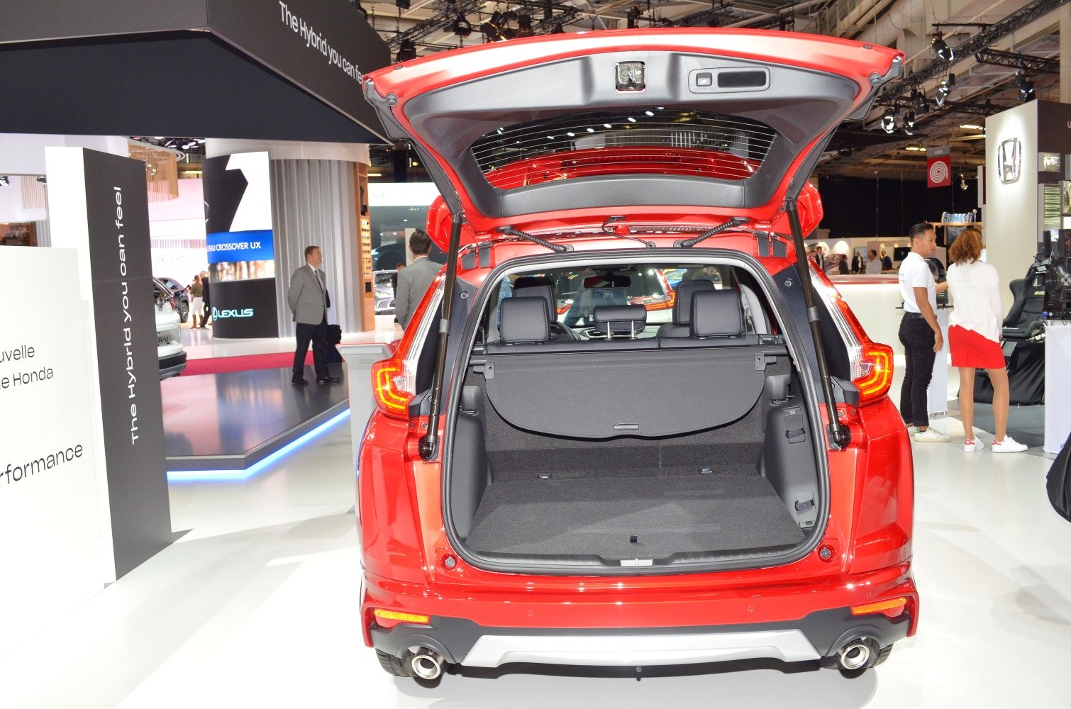 Spacious rear cargo area with open tailgate in red SUV