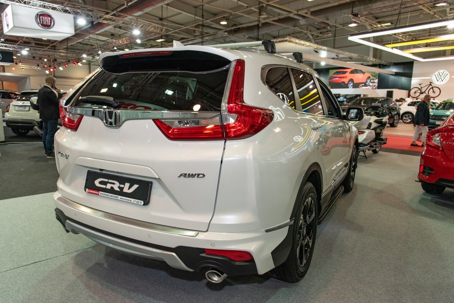 Rear view with distinctive tail lights and AWD badge
