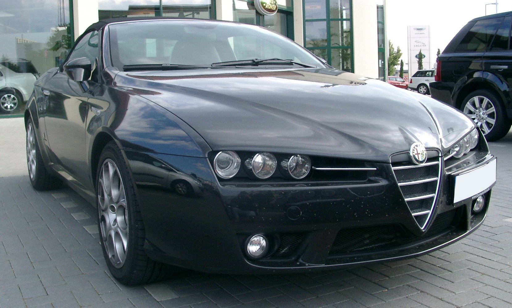 Close-up of front grille and triple round headlights