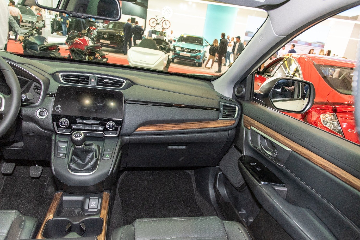 Interior dashboard with manual gear shift and wood trim accents