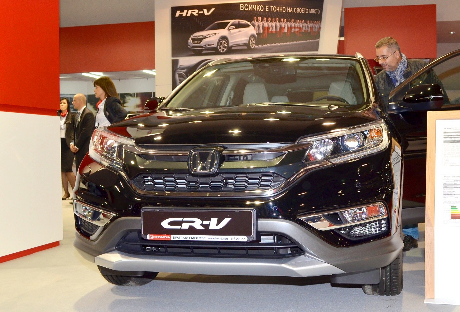 Front view of SUV with grille, headlights, and bumper design