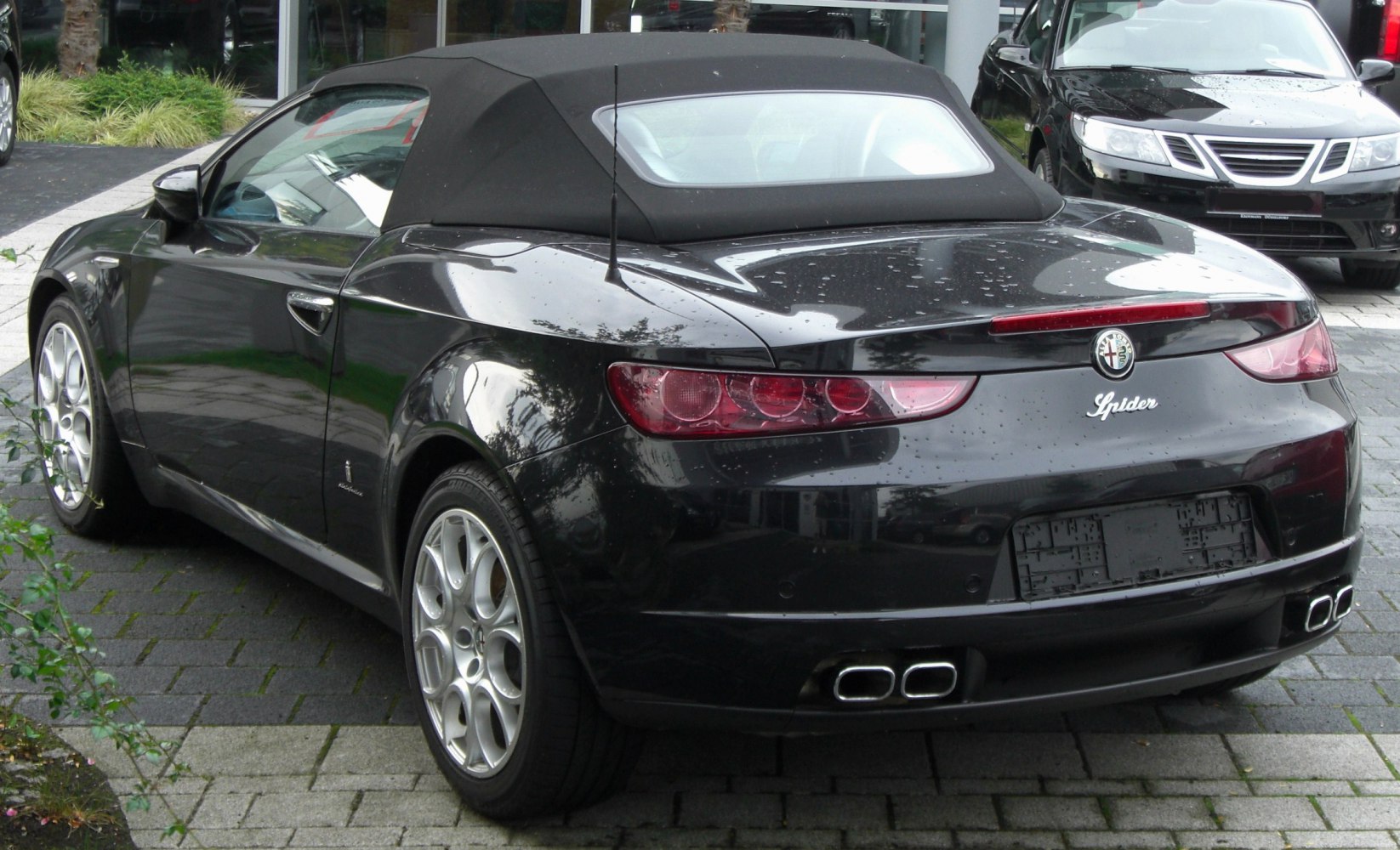 Convertible with soft top roof and distinctive quad exhaust