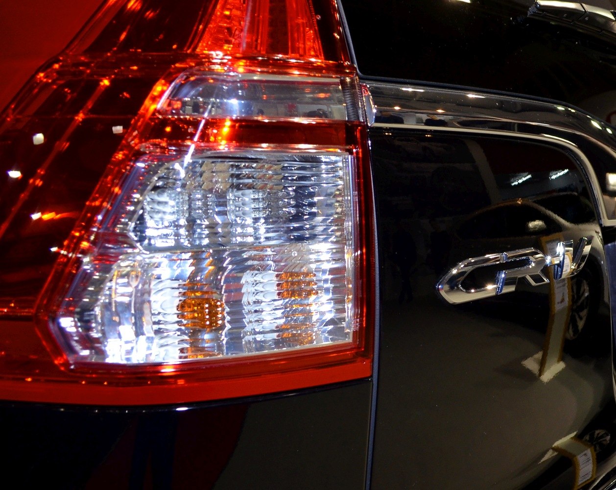 Close-up of rear tail light and CR-V badge on black vehicle