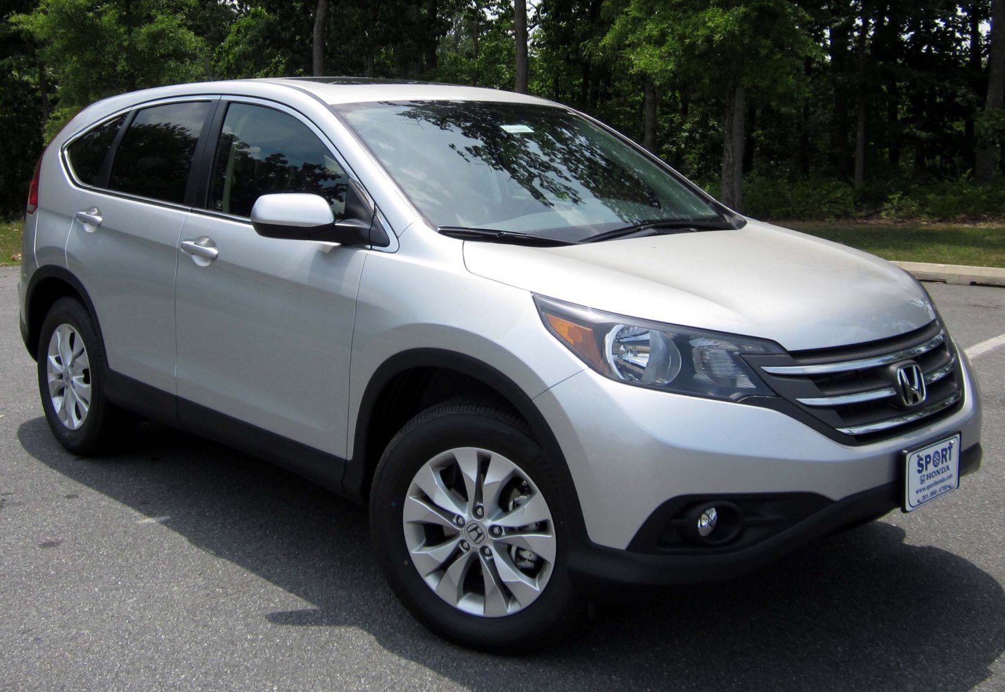 Silver SUV showing front-side with alloy wheels and sleek headlights