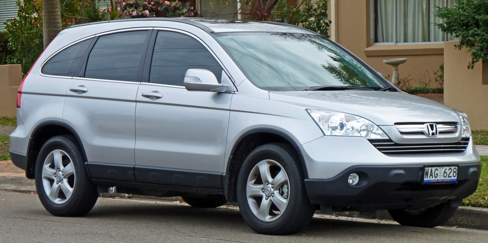 Silver mid-size SUV with alloy wheels and tinted windows