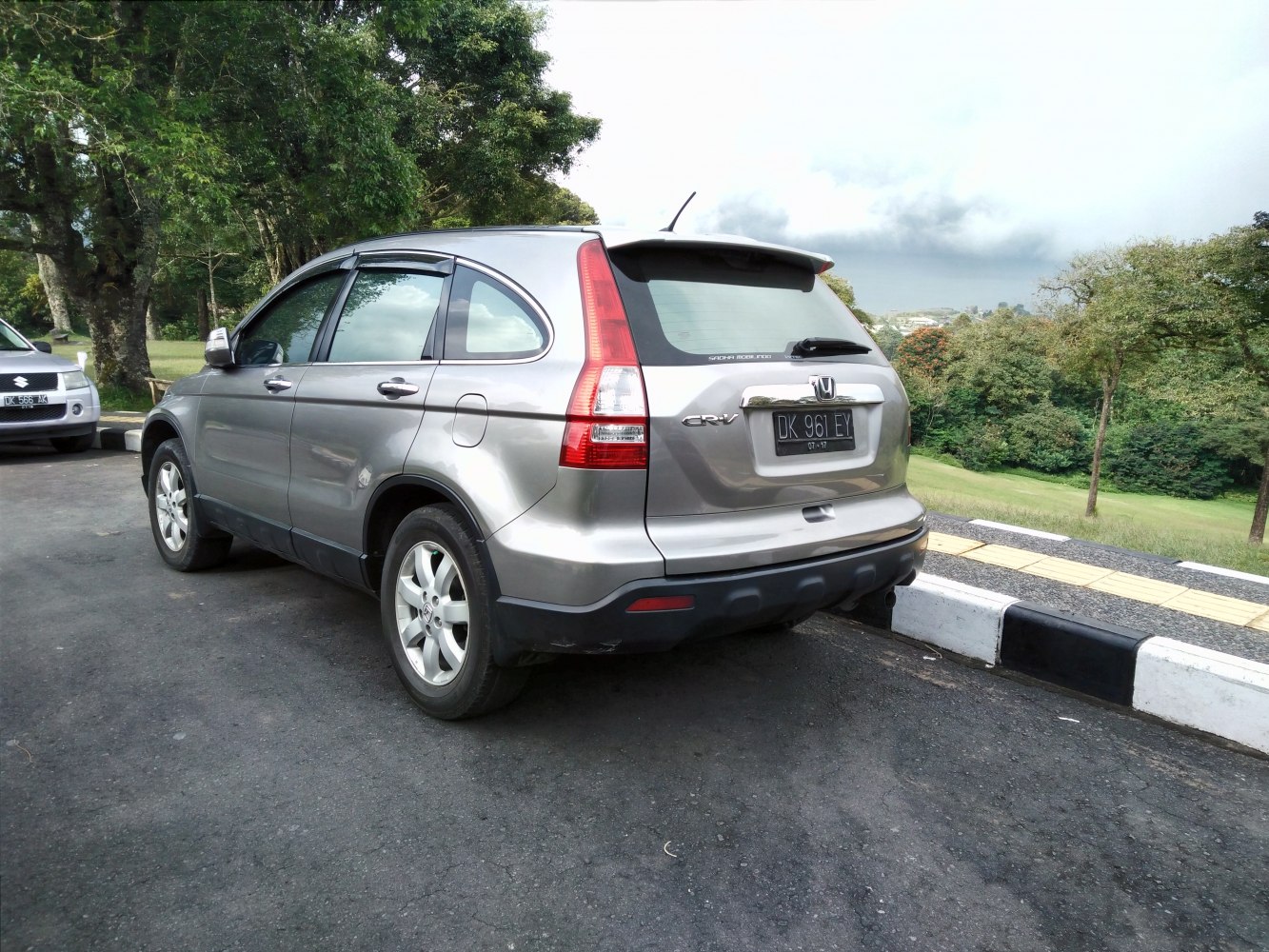 Rear-side view showing tall vertical tail lights and alloy wheels.