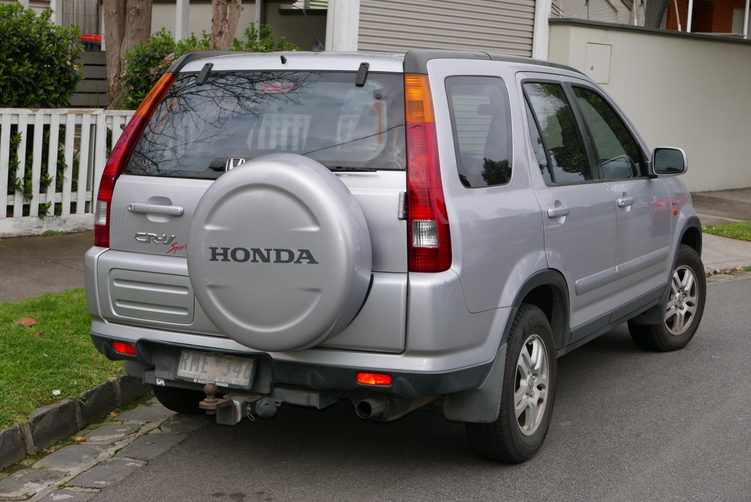 Rear-side view with spare wheel cover and vertical tail lights