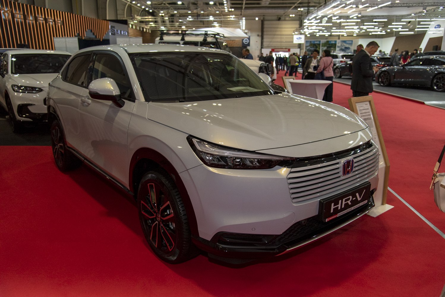 Sleek horizontal front grille with sharp LED headlights and black alloy wheels.