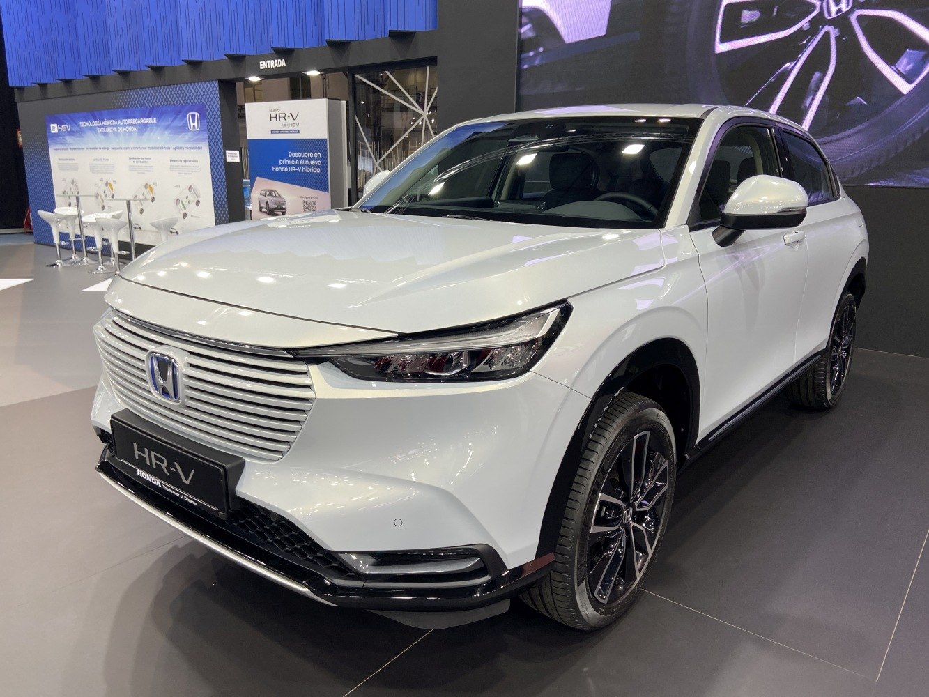 Front side view with sleek grille and modern headlights