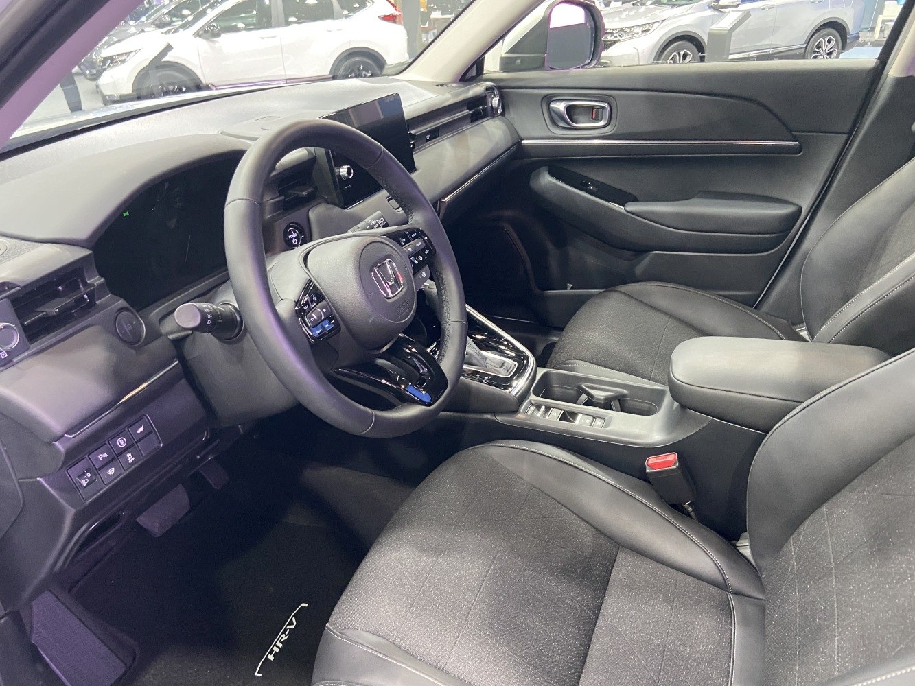 Modern dashboard with multifunction steering wheel and central infotainment screen
