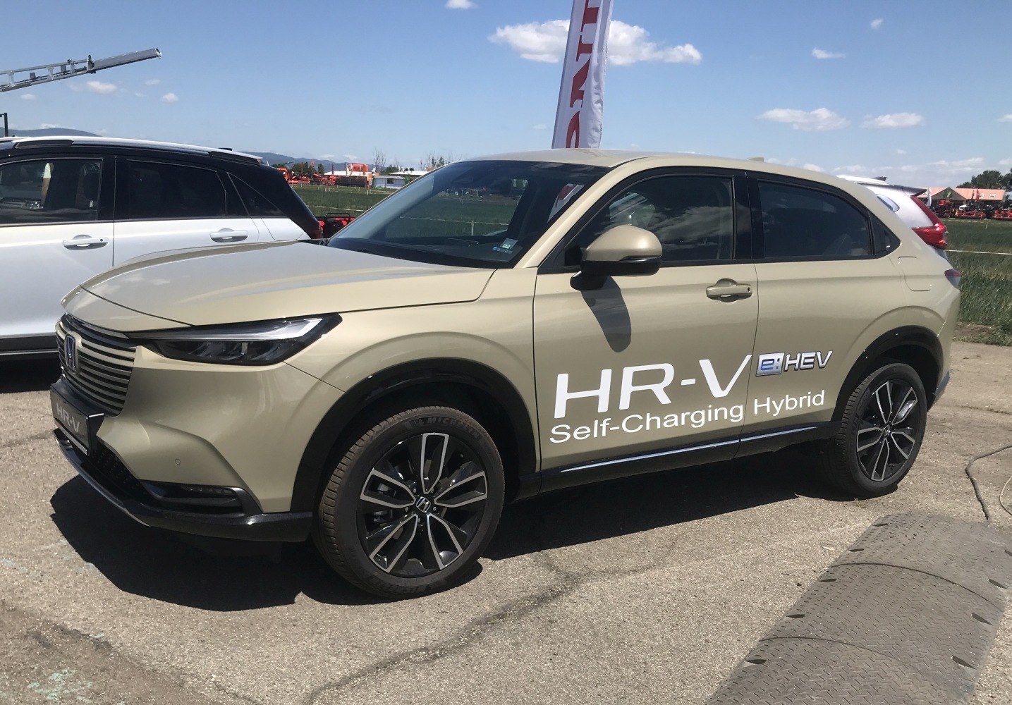Side profile of a hybrid SUV with alloy wheels and sleek design