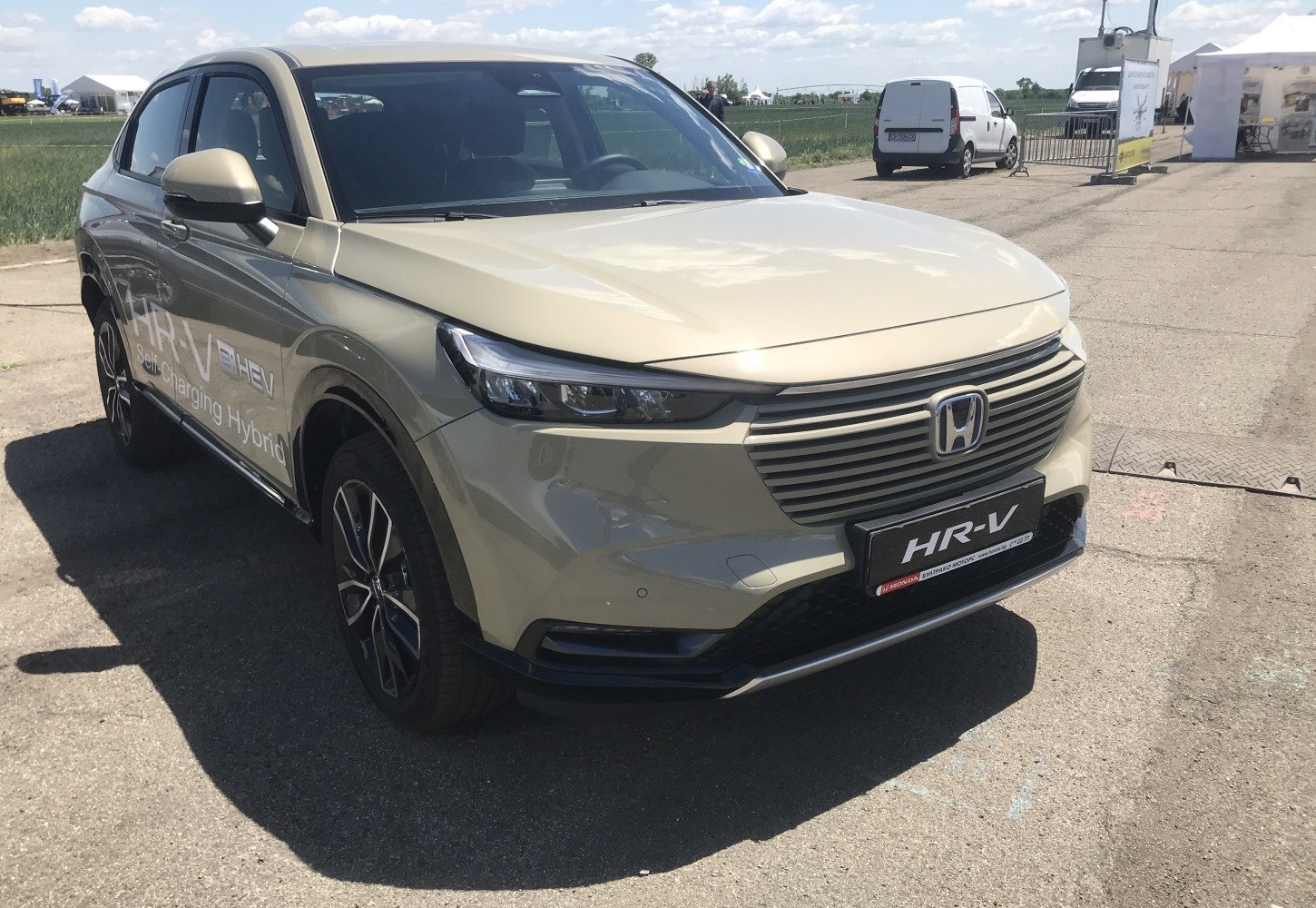 Front view with LED headlights, unique grille, and alloy wheels