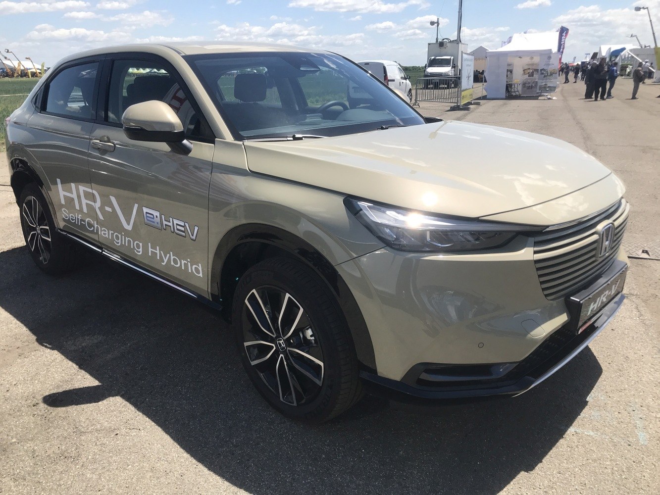 Front and side view of self-charging hybrid SUV with modern alloy wheels