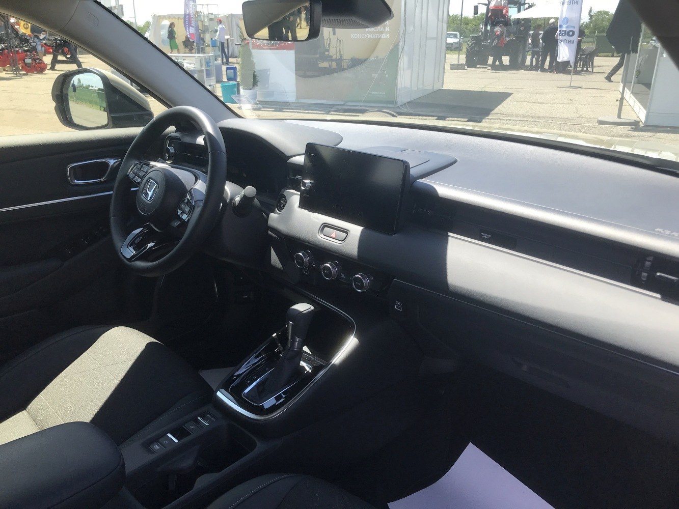 Dashboard with touchscreen infotainment and ergonomic steering wheel