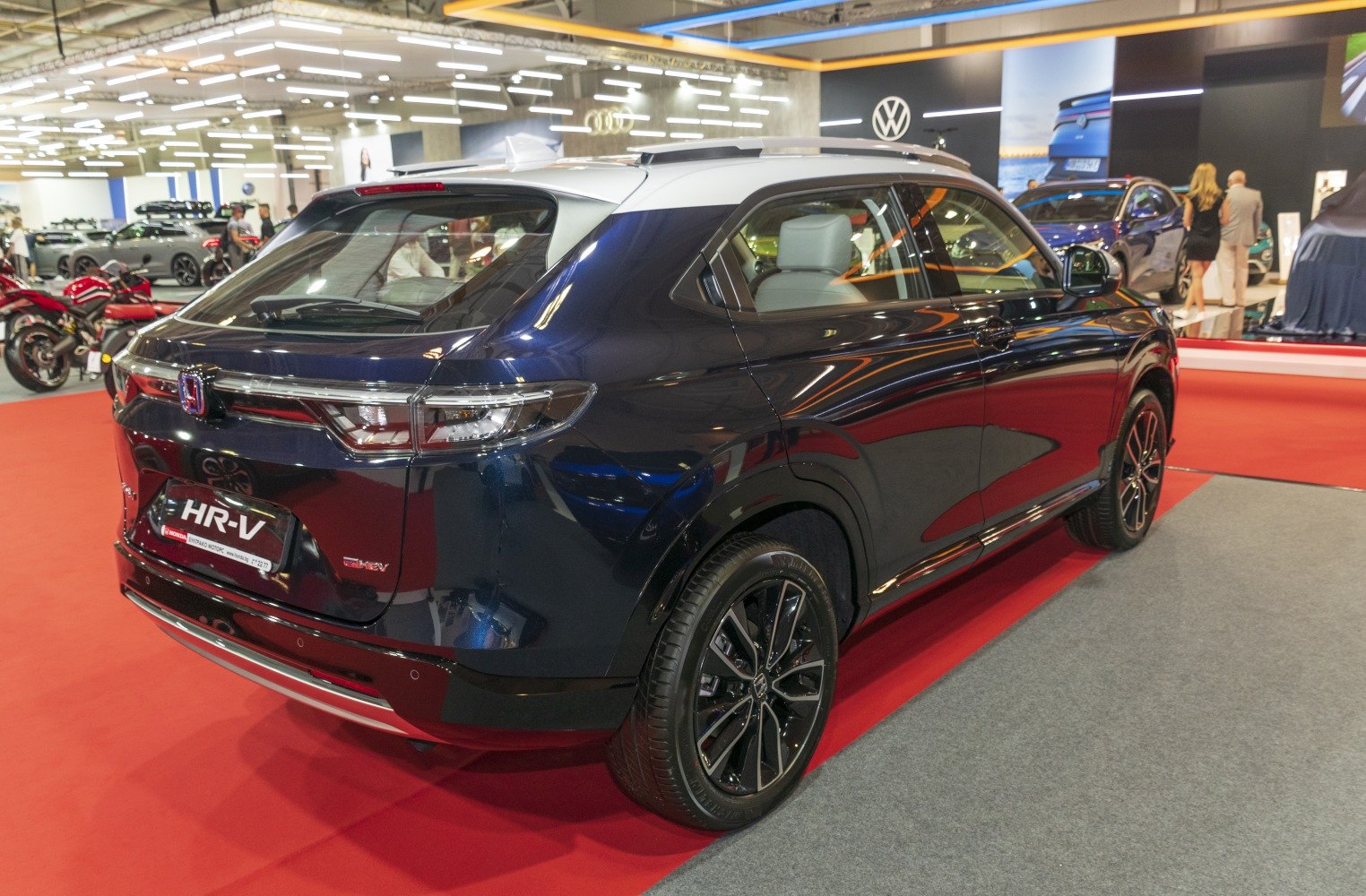 Rear and side view with sleek tail lights and alloy wheels