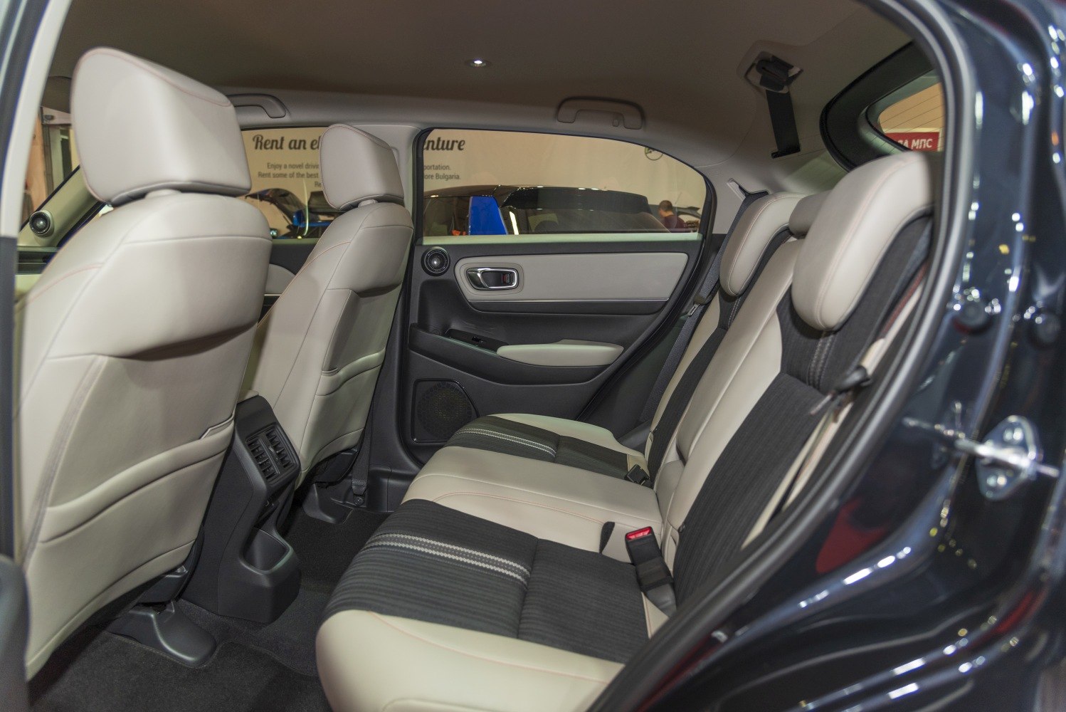 Beige and black two-tone rear seats inside a car