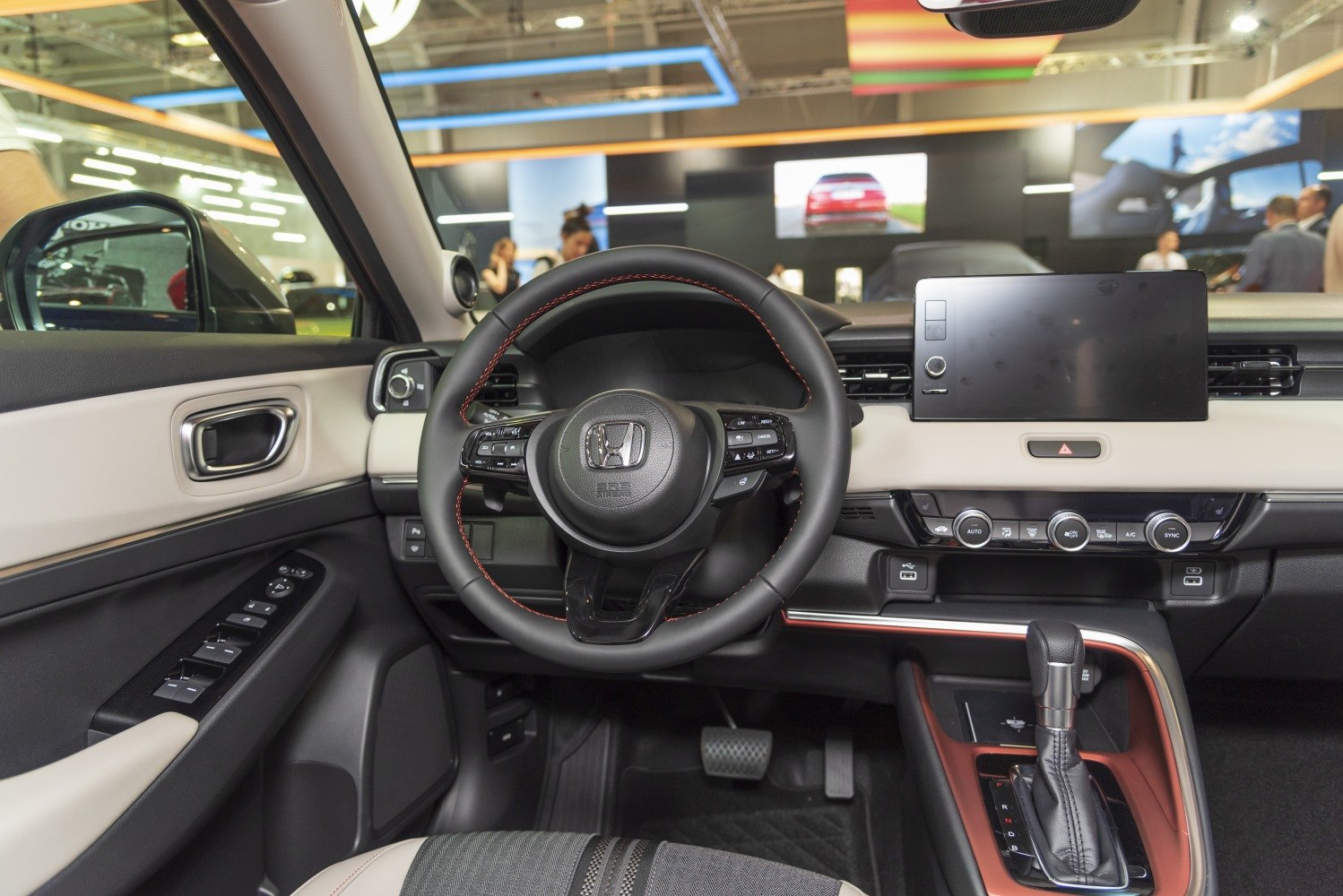 Modern car interior with multifunction steering wheel and touchscreen display