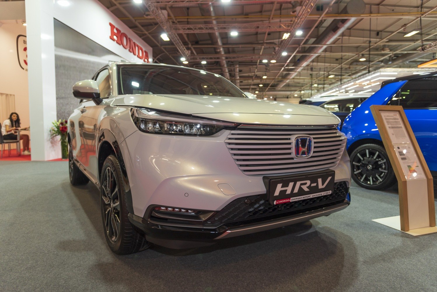 Front view with sleek LED headlights and horizontal slat grille