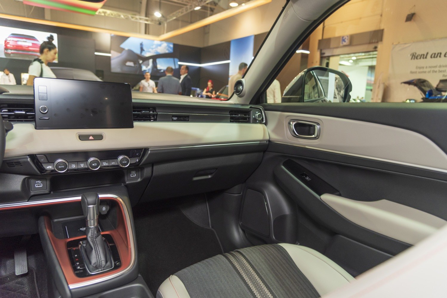 Touchscreen display and gear shift area in a modern car interior