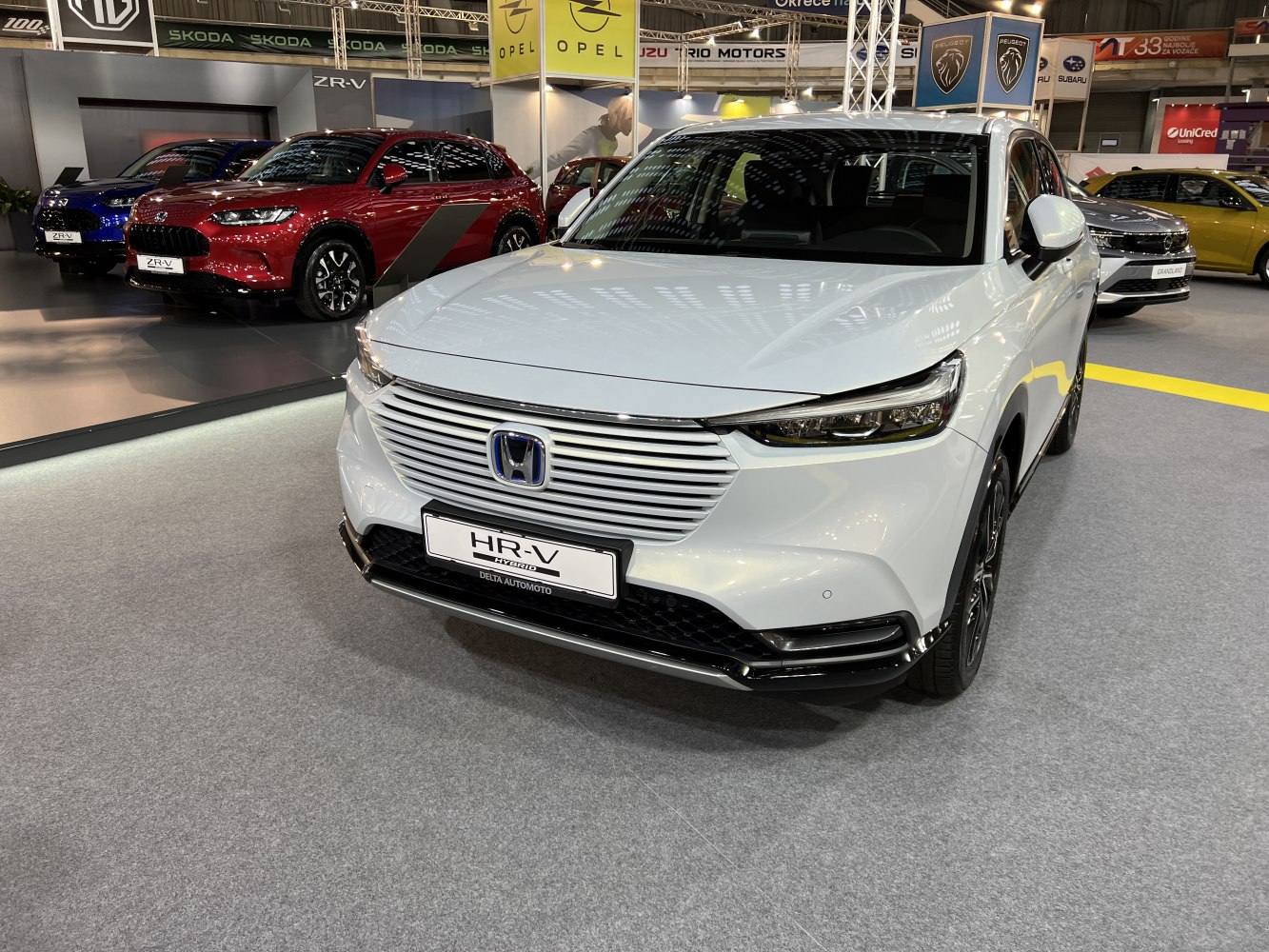 Sleek front grille with horizontal slats and slim LED headlights