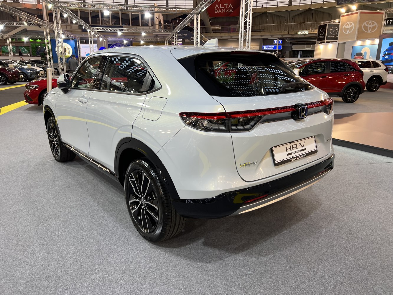 Rear and side view of hybrid SUV with LED tail lights and black alloy wheels