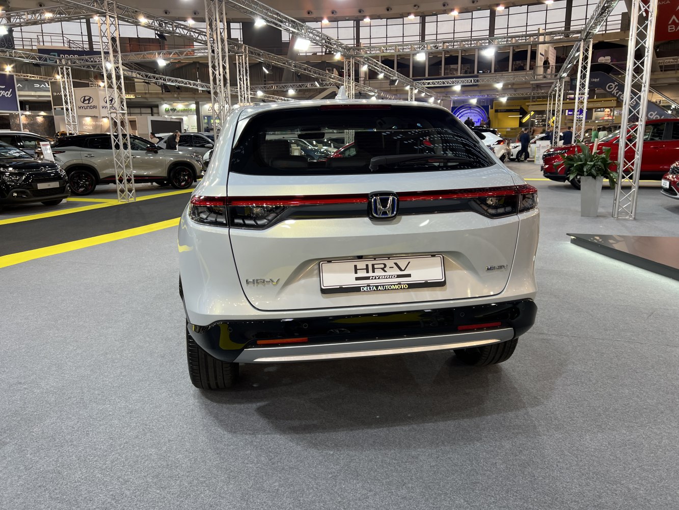 Rear design with sleek tail light bar and hybrid badge