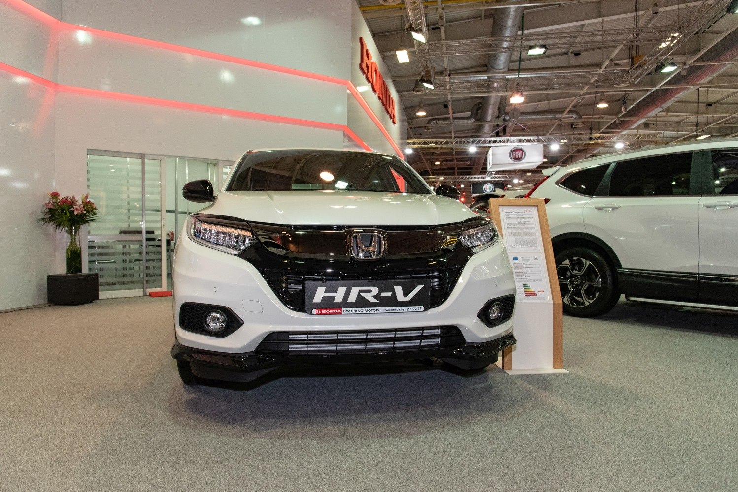 Front view of a compact SUV with LED headlights and black grille