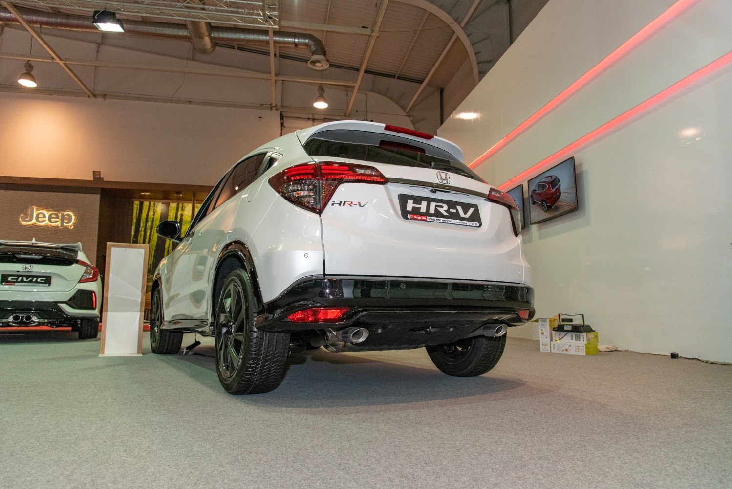 Rear view with dual exhaust pipes and LED taillights